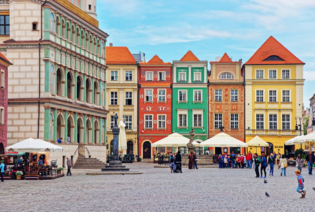 Poznan, Poland - May 7, 2014: Cafes and restaurants at Old Market Square in the city center of Poznan, Poland. People on the backgroundのeditorial素材
