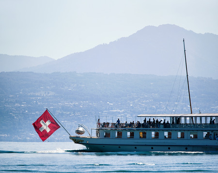 Ferry cruise in Lake Geneva in Lausanne, Switzerland. People on the backgroundの写真素材