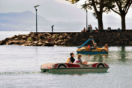 Lausanne, Switzerland - August 26, 2016: People in catamarans at Lake Geneva in Lausanne, Switzerlandのeditorial素材