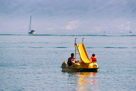 Lausanne, Switzerland - August 26, 2016: People in catamaran at Lake Geneva in Lausanne, Switzerlandのeditorial素材