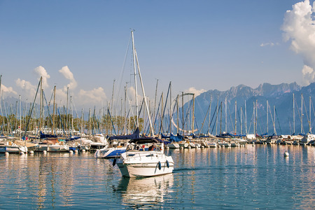 Lausanne, Switzerland - August 26, 2016: People in the yacht sailing at Marina on Lake Geneva in Lausanne, Ouchy fishing village, Switzerlandのeditorial素材