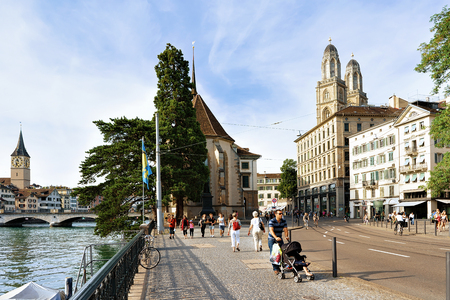 Zurich, Switzerland - September 2, 2016: Street with people at Grossmunster Church and Wasserkirche in Zurich, Switzerlandのeditorial素材