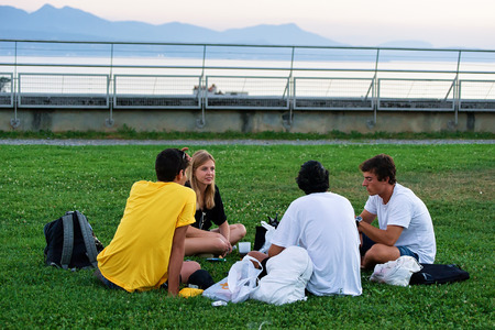 Lausanne, Switzerland - August 26, 2016: People at Esplanade de Montbenon in Lausanne at sunset, Switzerland.のeditorial素材