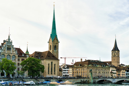 Saint Peter Church and Fraumunster Church at Limmat River quay in the city center of Zurich, Switzerland.の写真素材