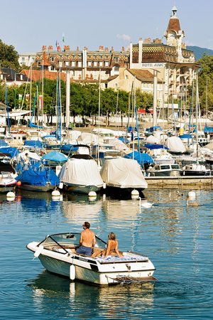 Lausanne, Switzerland - August 26, 2016: People in the motor boat at Marina in Lake Geneva in Lausanne, Ouchy fishing village, Switzerlandのeditorial素材