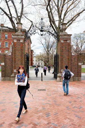 Cambridge, USA - April 29, 2015: Students at Entrance gate into Harvard Yard in Harvard University of Cambridge, Massachusetts, MA, USA. People on the backgroundのeditorial素材