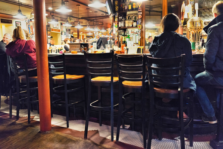 Boston, USA - April 28, 2015: People sitting at Bar counter in Boston, Massachusetts, the United States.のeditorial素材