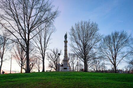 Soldiers and Sailors Monument in Boston Common public park in Boston, MA, United States. In the evening. People on the backgroundの写真素材