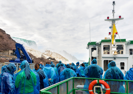 People aboard at Niagara Falls from the American side, USA. A view on American Falls and Bridal Veil Fallsのeditorial素材