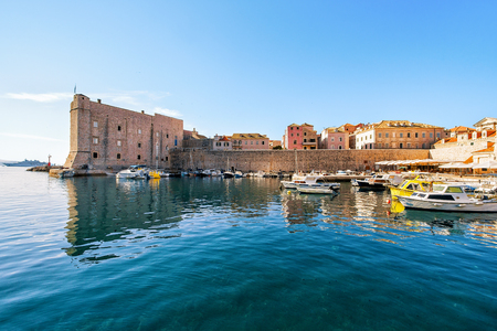 Dubrovnik Fortress and boats in the port at the Adriatic Sea, Croatiaの写真素材