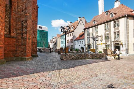 Riga, Latvia - September 3, 2014: People at the street market at St Peter Church in the historical center in the old town of Riga, Latvia.のeditorial素材
