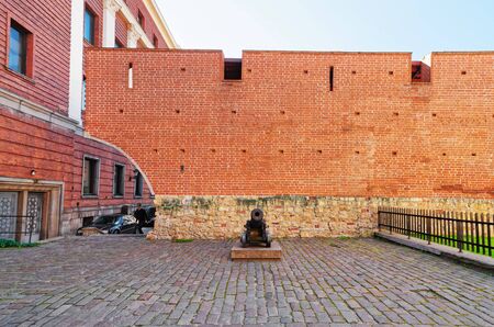 Riga, Latvia - September 3, 2014: Red brick walls in the historical center in the old town in Riga, Latvia. People on the backgroundのeditorial素材