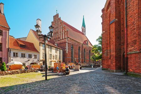 Riga, Latvia - September 3, 2014: People at St John Church in the historical center of the old town of Riga, Latvia.のeditorial素材