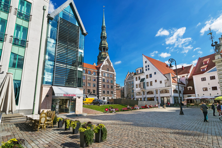 Riga, Latvia - September 3, 2014: Square with people and spire of Saint Peter Church in the historical center in the old town of Riga, Latvia.のeditorial素材