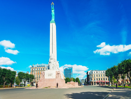 Riga, Latvia - September 3, 2014: Freedom monument and people at the old town of Riga, Latvia.のeditorial素材