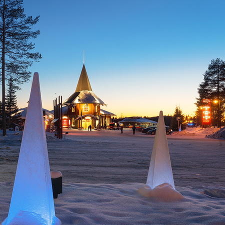 Rovaniemi, Finland - March 5, 2017: Santa Claus Holiday Village, Lapland, Finland, in winter, at sunset. People on the backgroundのeditorial素材