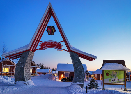 Rovaniemi, Finland - March 5, 2017: Entrance gate in Santa Claus Holiday Village Houses, Lapland, Finland, on Arctic Circle in winter. After sunsetのeditorial素材
