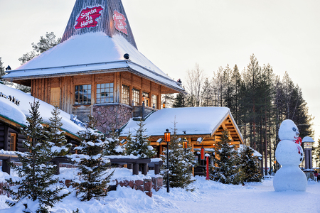 Rovaniemi, Finland - March 5, 2017: Santa Claus Office with Snowman at Santa Village with Christmas trees, Lapland, Finland, on Arctic Circle in winter.のeditorial素材