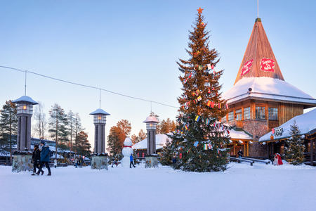 Rovaniemi, Finland - March 5, 2017: People in Santa Claus Office in Santa Village with Christmas trees, Lapland, Finland, on Arctic Circle in winter.のeditorial素材