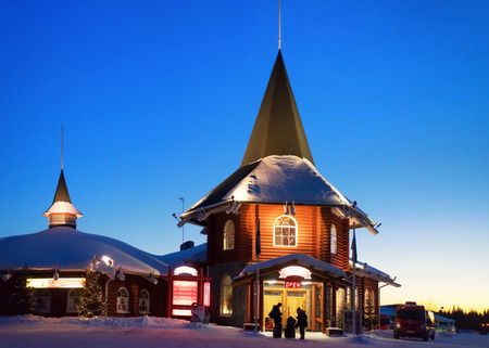Rovaniemi, Finland - March 5, 2017: Santa Claus Holiday Village in Lapland, Finland, in winter. In the evening. People on the backgroundのeditorial素材