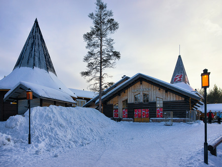 Rovaniemi, Finland - March 5, 2017: People at Santa Village with Christmas trees, Lapland, Finland, on Arctic Circle in winter.のeditorial素材