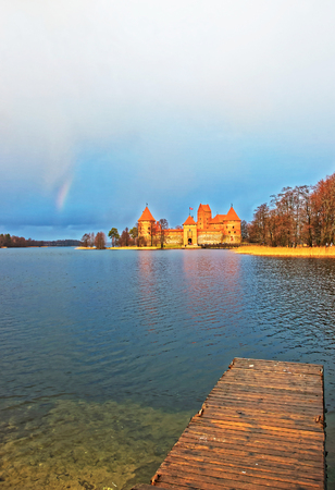 Trakai island castle museum and rainbow at Galve lake, near Vilnius, Lithuaniaの写真素材