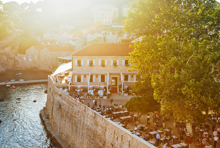 Dubrovnik, Croatia - August 19, 2016: People at Open Street terraced bar in Dubrovnik, of Croatia. View from the defensive city walls. At sunsetのeditorial素材