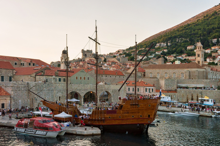 Dubrovnik, Croatia - August 19, 2016: Ship at the Old port in the Adriatic Sea in Dubrovnik, Croatia. People on the backgroundのeditorial素材