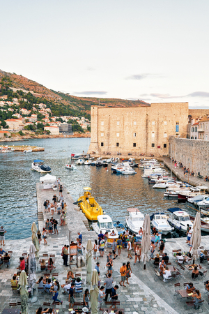 Dubrovnik, Croatia - August 19, 2016: Evening in St John Fortress and Sailing boats and people at the Old port in the Adriatic Sea in Dubrovnik, in Croatiaのeditorial素材