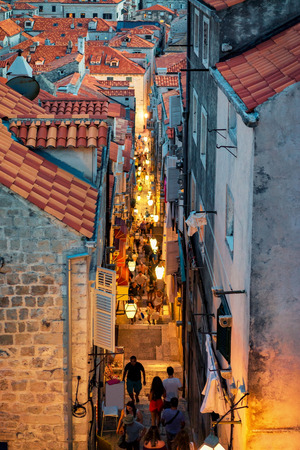 Dubrovnik, Croatia - August 19, 2016: Busy street with tourists in Dubrovnik old city, in Croatia. Late in the eveningのeditorial素材