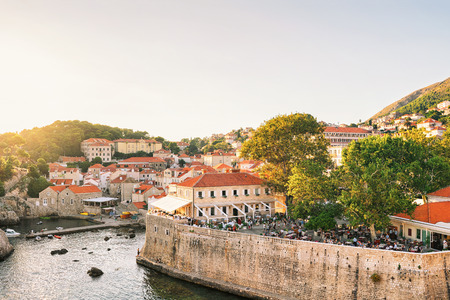 People at Open Street terrace restaurant in Dubrovnik, of Croatia. View from the defensive city walls. At sunsetの写真素材