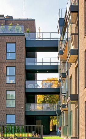 Vilnius, Lithuania - October 2, 2016: Glass modern architecture of apartment residential building. And outdoor facilities.のeditorial素材