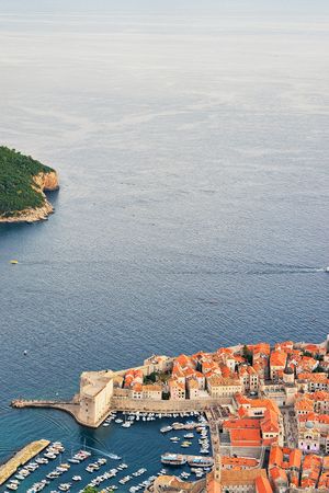 Aerial view of Old city roofs and Adriatic sea in Dubrovnik, in Croatia in the eveningの写真素材