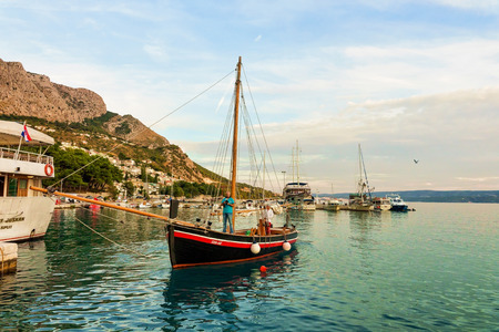 Omis, Croatia - August 17, 2016: People on Boats at the harbor of the Adriatic Sea in Omis, Dalmatia, Croatiaのeditorial素材