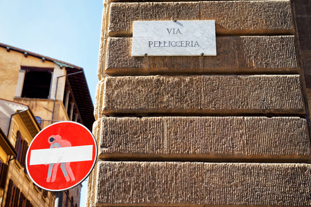 Via Pellicceria Street sign on the wall, Florence, Tuscany, Italyの写真素材
