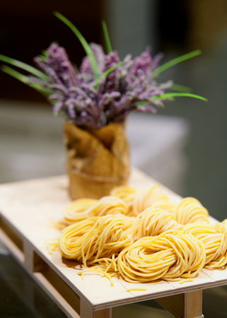 Italian traditional pasta on wooden background at restaurant in Florence, Tuscany, Italy.の写真素材