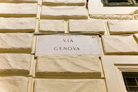 Via Genova street sign on the wall in Rome, Italyの写真素材