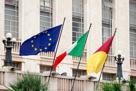 Italian national flag, Rome Commune flag and EU one in Rome, Italy.の写真素材