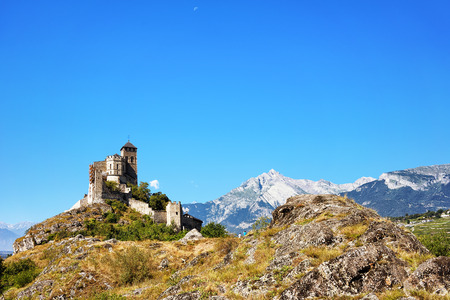 Valere Basilica in the hill in Sion, capital of Canton Valais, Switzerland. Bernese Alps on the backgroundの写真素材