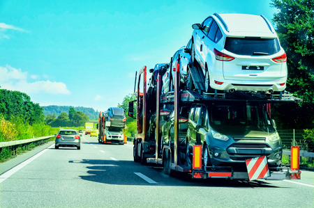 Car transporter truck on the road, in Switzerland.の写真素材