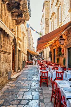 Dubrovnik, Croatia - August 20, 2016: Street terraced cafe in the Old city in Dubrovnik, in Croatia. People on the backgroundのeditorial素材
