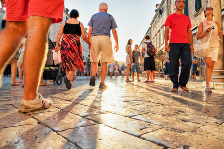 Dubrovnik, Croatia - August 20, 2016: Crowds of people at Stradun Street at sunset in the Old city of Dubrovnik, Croatia. Sun reflected in stone.のeditorial素材
