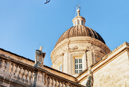 Dome of Dubrovnik Cathedral  and religious saints on the facade in the Old city of Dubrovnik, Croatiaの写真素材