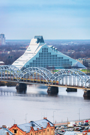 View of Railway Bridge and Daugava River in Riga at sunset in winterのeditorial素材