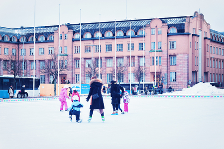 Helsinki, Finland - March 8, 2017: People skating at Central Railway Station Square in Helsinki, Finland in winter.のeditorial素材