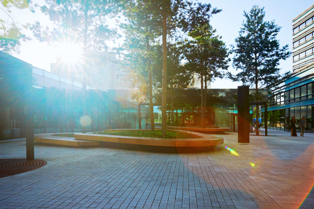 Vilnius, Lithuania - August 8, 2017: Comfort public park zone at the entrance into modern steel and glass skyscraper building.のeditorial素材
