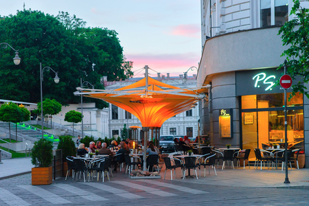 Vilnius, Lithuania - June 6, 2017: People at the open air street restaurant in the Old city of Vilnius, Lithuania.のeditorial素材
