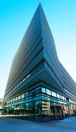 Vilnius, Lithuania - August 8, 2017: Futuristic business center architecture of modern metal and...