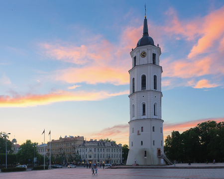 Vilnius, Lithuania - June 6, 2017: People in Cathedral Square with Bell tower in the historical city center in Vilnius, Lithuania. At sunsetのeditorial素材