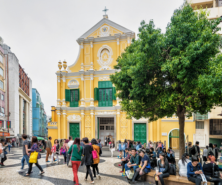 Macao, China - March 8, 2016: St People at Dominic Church in Senado Square in Historical old city center in Macao, China. People on the backgroundのeditorial素材